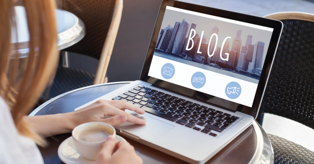 woman looking at laptop with blog on screen | 8 Benefits of Blogging for Business